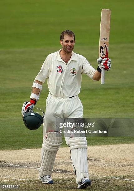 Simon Katich of Australia celebrates scoring his century during day four of the Third Test match between Australia and Pakistan at Bellerive Oval on...