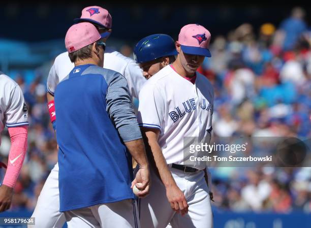 Sam Gaviglio of the Toronto Blue Jays exits the game as he is relieved by manager John Gibbons in the eighth inning during MLB game action against...