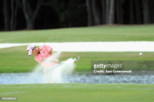 Danny Lee of New Zealand plays a shot from a bunker on the seventh hole during the final round of THE PLAYERS Championship on the Stadium Course at...