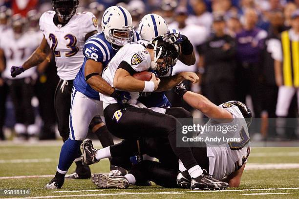 Gary Brackett of the Indianapolis Colts sacks quarterback Joe Flacco of the Baltimore Ravens for a six-yard loss in the second quarter of the AFC...