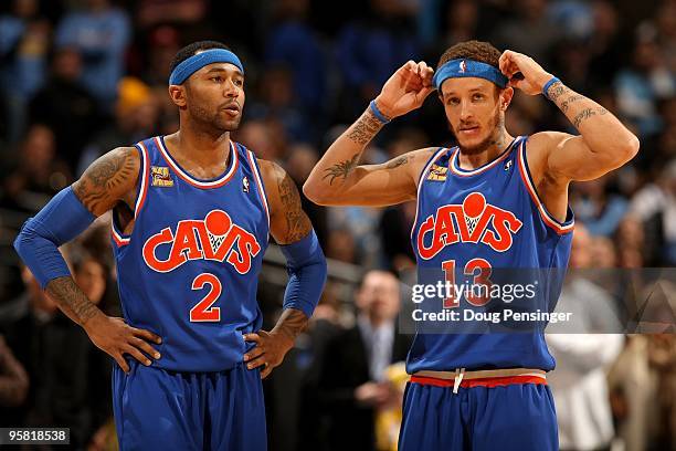 Mo Williams and Delonte West of the Cleveland Cavaliers look on during a break in the action against the Denver Nuggets during NBA action at Pepsi...