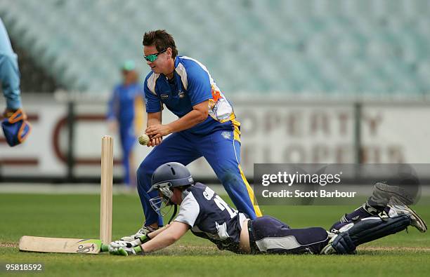 Kris Britt of the Meteros unsuccessfully attempts to run out Jess Cameron of the Spirit during the WNCL match between the Victorian Spirit and the...