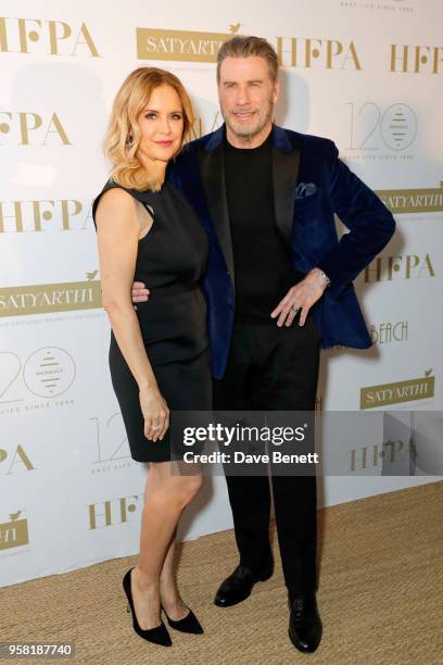 Kelly Preston and John Travolta attend the HFPA Event with Particpant Media to Honor the Kailash Satyarthi Children's Foundation in partnership with...