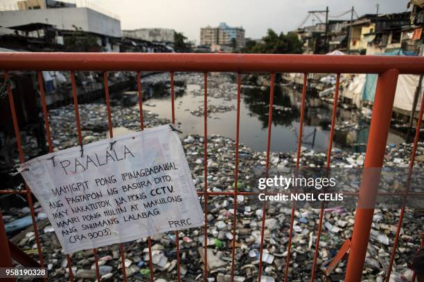 This photo taken on May 13, 2018 shows a garbage-filled Estero de Reyna in Manila.