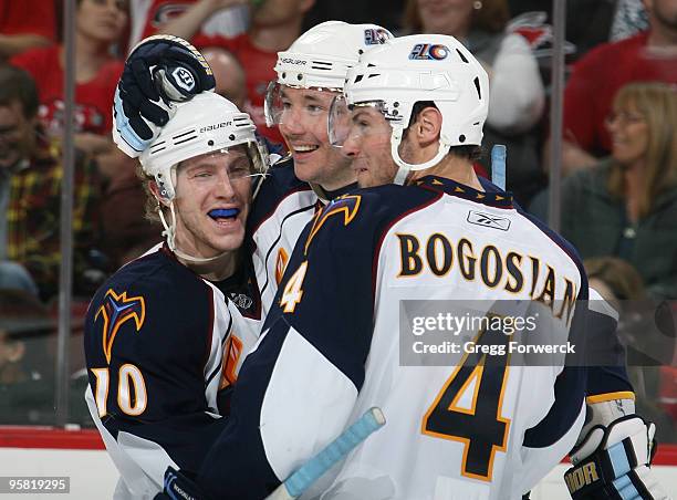 Ilya Kovalchuk of the Atlanta Thrashers celebrates his third period goal with teammates Bryan Little and Zach Bogosian during an NHL game against the...