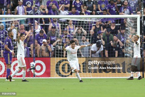 Ezequiel Barco of Atlanta United FC celebrates a goal with Josef Martinez and Miguel Almiron of Atlanta United FC during a MLS soccer match against...