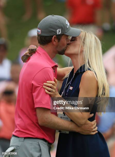 Webb Simpson of the United States celebrates with his wife Taylor on the 18th green after winning during the final round of THE PLAYERS Championship...