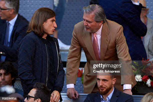 Inigo Mendez de Vigo and Filipe Luis attend day nine of the Mutua Madrid Open at La Caja Magica on May 13, 2018 in Madrid, Spain.