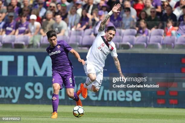 Fabio Pisacane of Cagliari Calcio in action against Giovanni Simeone of ACF Fiorentina during the serie A match between ACF Fiorentina and Cagliari...