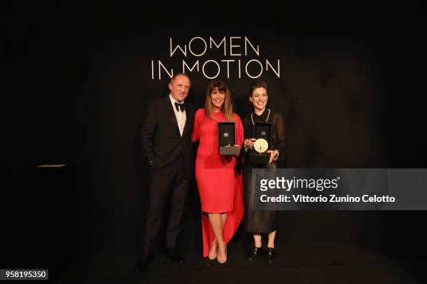 Francois-Henry Pinault, Patty Jenkins and Carla Simon pose with the Women in Motion Award at Place de la Castre on May 13, 2018 in Cannes, France.