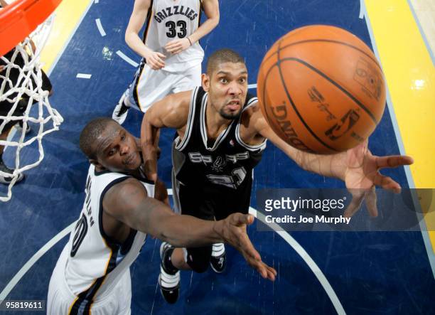 Tim Duncan of the San Antonio Spurs and Zach Randolph of the Memphis Grizzlies fight for a rebound on January 16, 2010 at FedExForum in Memphis,...