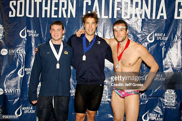 David Russell, Matt Grevers and Markus Rogan pose following the Men's 200 Backstroke Final during the Long Beach Grand Prix on January 16, 2010 in...