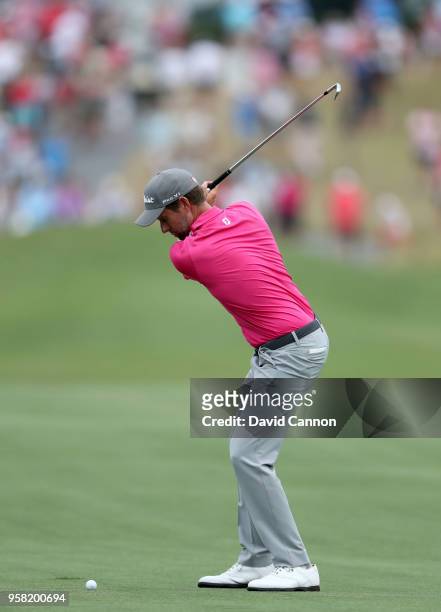 Webb Simpson of the United States plays his second shot on the par 4, 18th hole during the final round of the THE PLAYERS Championship on the Stadium...