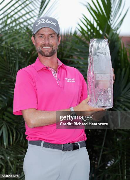 Webb Simpson of the United States celebrates with the winner's trophy after the final round of THE PLAYERS Championship on the Stadium Course at TPC...