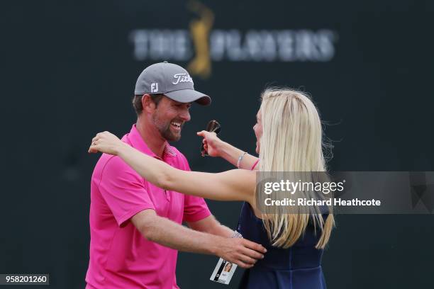 Webb Simpson of the United States celebrates with his wife Taylor Dowd on the 18th green after winning during the final round of THE PLAYERS...
