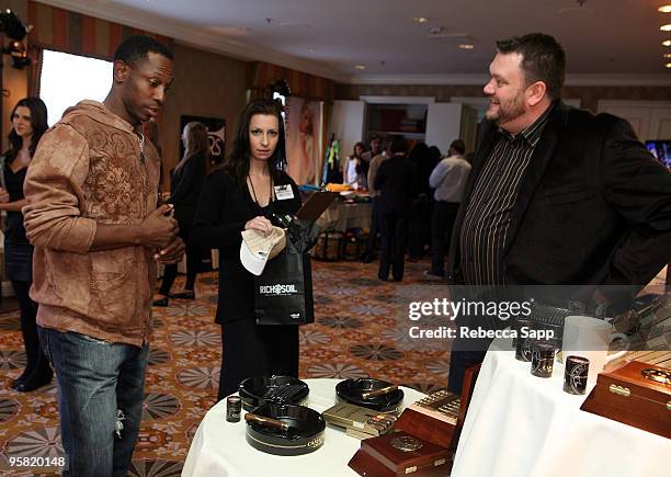 Baseball player Kenny Lofton visits the Camacho Cigars display during the HBO Luxury Lounge in honor of the 67th annual Golden Globe Awards held at...