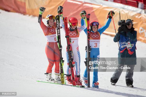 Mikaela Shiffrin of the United States after winning the gold medal with silver medalist Ragnhild Mowinckel of Norway and bronze medalist Federica...
