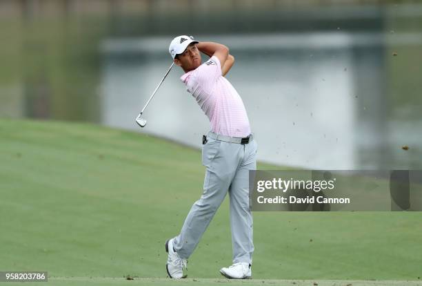 Xander Schauffele of the United States plays his second shot on the par 4, 18th hole during the final round of the THE PLAYERS Championship on the...