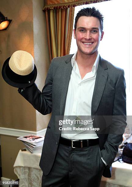 Actor Owain Yeoman poses at the Block Headwear display during the HBO Luxury Lounge in honor of the 67th annual Golden Globe Awards held at the Four...