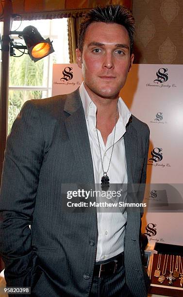 Actor Owain Yeoman visits the Simmons Jewelry Co. Display during the HBO Luxury Lounge in honor of the 67th annual Golden Globe Awards held at the...
