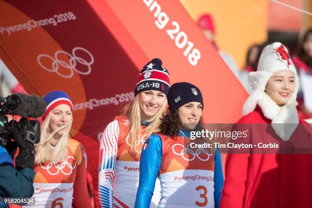 Mikaela Shiffrin of the United States at the presentation after winning the gold medal with silver medalist Ragnhild Mowinckel of Norway and bronze...