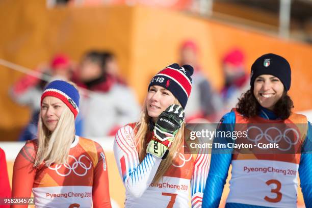 Mikaela Shiffrin of the United States at the presentation after winning the gold medal with silver medalist Ragnhild Mowinckel of Norway and bronze...