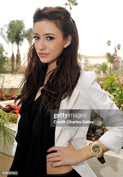 Actress Christian Serratos poses at the Invicta Watch Group suite during the HBO Luxury Lounge in honor of the 67th annual Golden Globe Awards held...