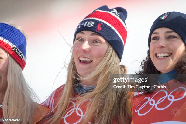 Mikaela Shiffrin of the United States celebrates at the presentation after winning the gold medal with silver medalist Ragnhild Mowinckel of Norway...