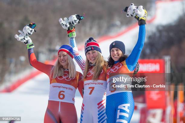 Mikaela Shiffrin of the United States celebrates at the presentation after winning the gold medal with silver medalist Ragnhild Mowinckel of Norway...