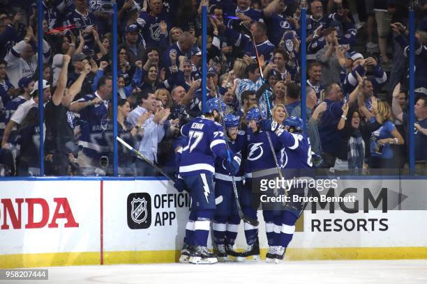 Brayden Point of the Tampa Bay Lightning celebrates with his teammates after scoring a goal on Braden Holtby of the Washington Capitals during the...