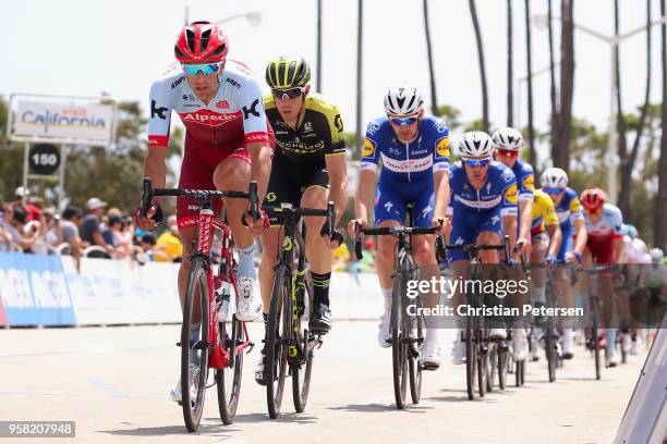 Reto Hollenstein of Switzerland and Team Katusha Alpecin and Mathew Hayman of Australia and Team Mitchelton-Scott lead the peloton during stage one...