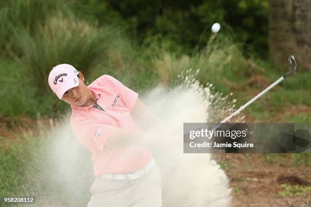 Danny Lee of New Zealand plays a shot from a bunker on the 14th hole during the final round of THE PLAYERS Championship on the Stadium Course at TPC...