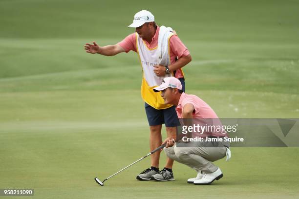 Danny Lee of New Zealand lines up a putt on the 11th green during the final round of THE PLAYERS Championship on the Stadium Course at TPC Sawgrass...