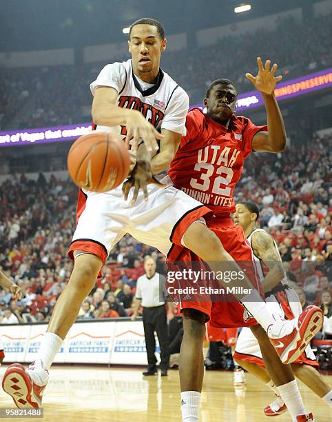 Chace Stanback of the UNLV Rebels and Shawn Glover of the Utah Utes fight for a rebound during their game at the Thomas & Mack Center January 16,...