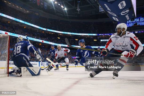 Goalie Andrei Vasilevskiy and Mikhail Sergachev of the Tampa Bay Lightning give up a goal against Devante Smith-Pelly of the Washington Capitals...