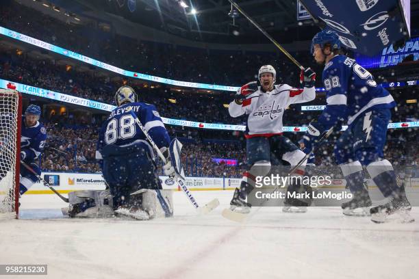 Goalie Andrei Vasilevskiy and Mikhail Sergachev of the Tampa Bay Lightning give up a goal against Jay Beagle and the Washington Capitals during Game...