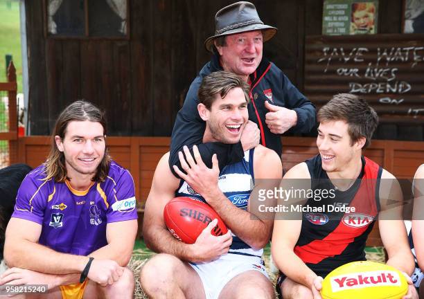 Legend Essendon Bombers former coach Kevin Sheedy gets Tom Hawkins of the Cats in a headlock next to Zach Merrett of the Bombers during the Powercor...