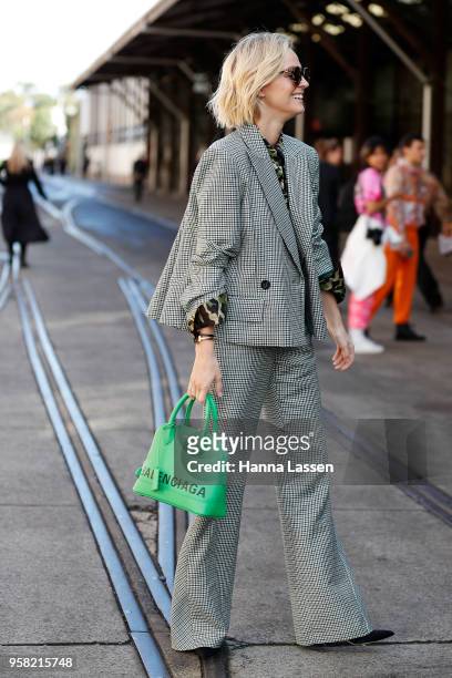 Nadia Fairfax wearing Carla Zampatti suit and Balenciaga bag during Mercedes-Benz Fashion Week Resort 19 Collections at Carriageworks on May 14, 2018...