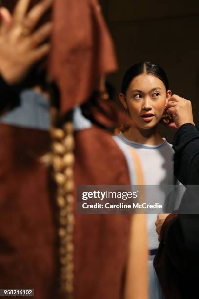 Model prepares backstage ahead of the Albus Lumen show at Mercedes-Benz Fashion Week Resort 19 Collections at Carriageworks on May 14, 2018 in...