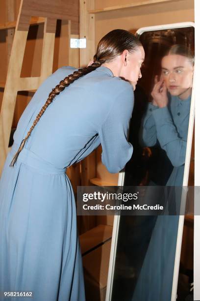 Model prepares backstage ahead of the Albus Lumen show at Mercedes-Benz Fashion Week Resort 19 Collections at Carriageworks on May 14, 2018 in...