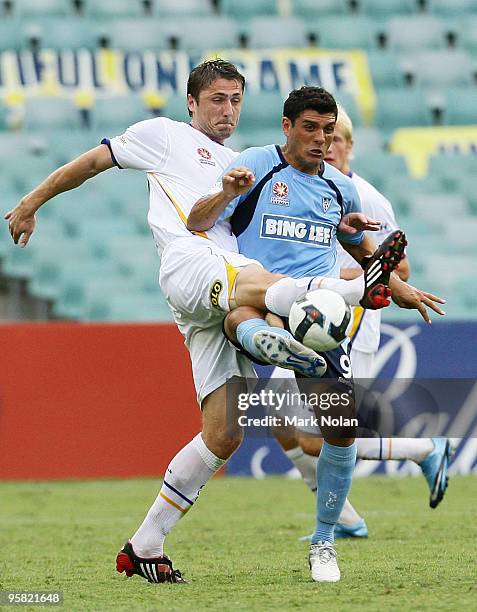 Dino Djulbic of the Gold Coast and John Alosi of Sydney contest possession during the round 23 A-League match between Sydney FC and Gold Coast United...