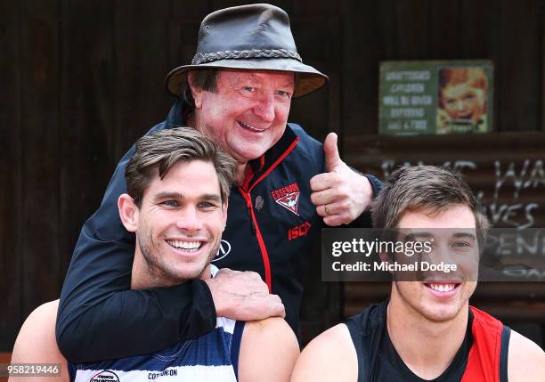 Legend Essendon Bombers former coach Kevin Sheedy gets Tom Hawkins of the Cats in a headlock next to Zach Merrett of the Bombers during the Powercor...