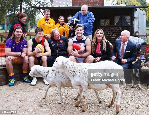 Legend Essendon Bombers former coach Kevin Sheedy with Tom Hawkins of the Cats and Zach Merrett of the Bombers pose during Launch at Melbourne...