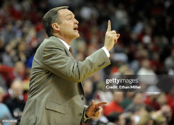 Rebels head coach Lon Kruger gestures to his players during a game against the Utah Utes at the Thomas & Mack Center January 16, 2010 in Las Vegas,...