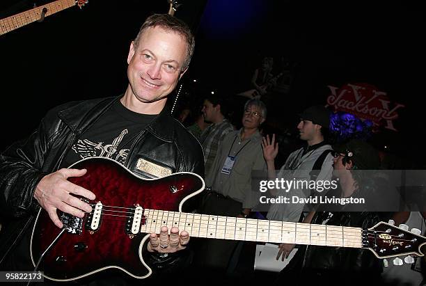 Actor Gary Sinise poses with an EVH Wolfgang guitar during the 2010 NAMM Show - Day 3 at the Anaheim Convention Center on January 16, 2010 in...