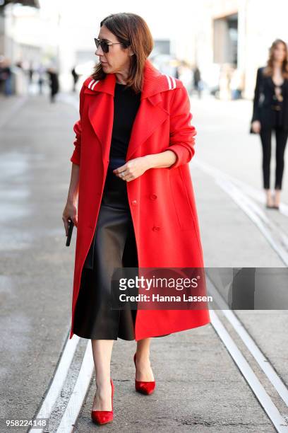 Edwina McCann wearing red coatand hills during Mercedes-Benz Fashion Week Resort 19 Collections at Carriageworks on May 14, 2018 in Sydney, Australia.