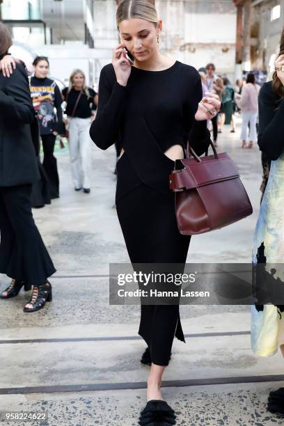 Jasmine Yarbrough wearing Sir dress and Givenchy bag during Mercedes-Benz Fashion Week Resort 19 Collections at Carriageworks on May 14, 2018 in...