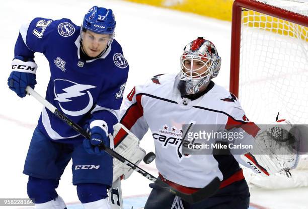 Braden Holtby of the Washington Capitals makes a save against Yanni Gourde of the Tampa Bay Lightning during the third period in Game Two of the...