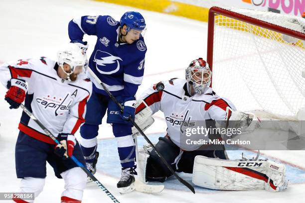 Braden Holtby of the Washington Capitals makes a save against Yanni Gourde of the Tampa Bay Lightning during the third period in Game Two of the...