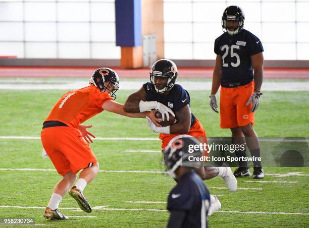 Chicago Bears rookie quarterback Bryan Schor hands to football to Chicago Bears rookie fullback Melvin Vaughn during the Chicago Bears Rookie...